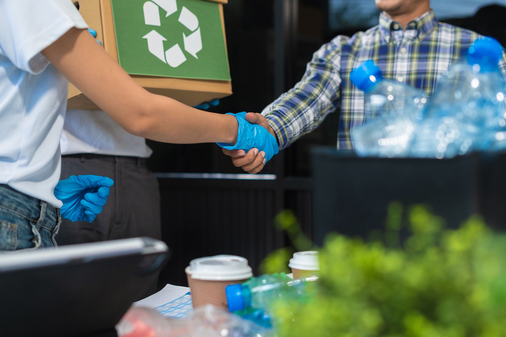 Business people working examining waste recyclable separation divided bin in the office, Sustainable development and innovation green business concept.